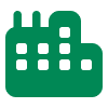 Ein einfaches Icon eines Gebäudes mit Fenstern und Schornsteinen in einer einfarbigen, grünen Darstellung